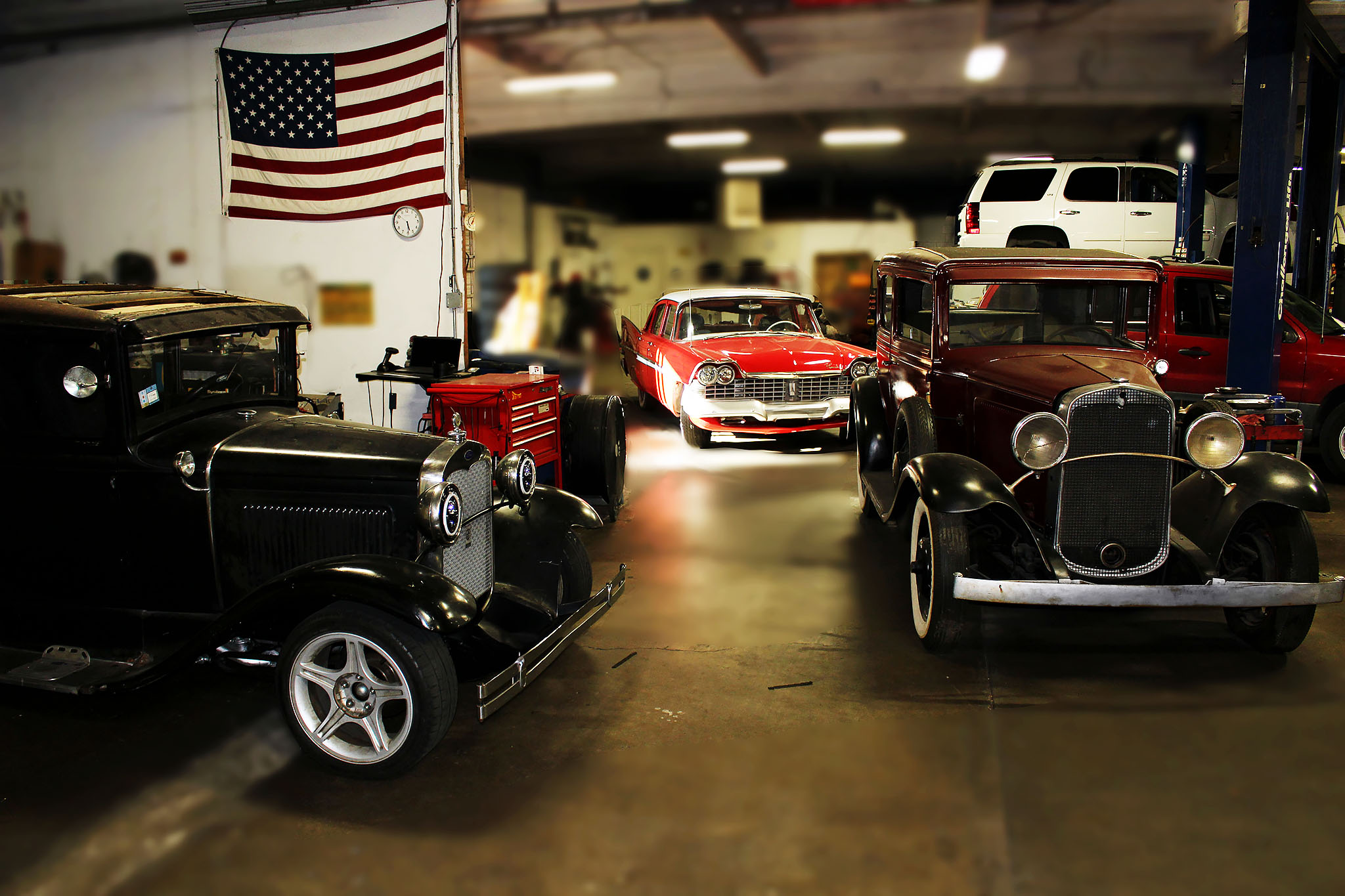 Collection of three antique cars in our garage